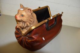 Modern composition model of a cat in a gladstone bag