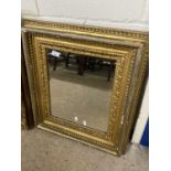 19th Century gilt picture frame containing a bevelled mirror