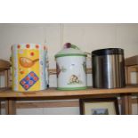 Two ceramic biscuit barrels and another