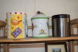 Two ceramic biscuit barrels and another