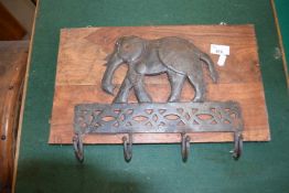 Hardwood and metal mounted coat rack with elephant decoration