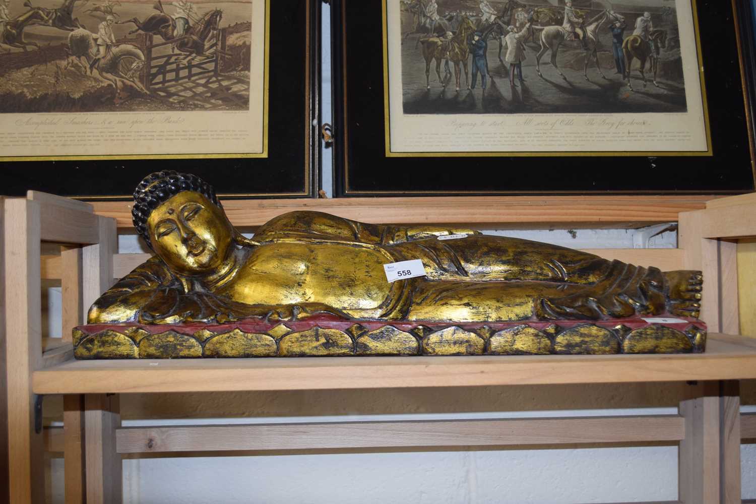 20th Century gilt wooden decorated Buddhist figure, 60cm long