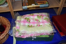 Pair of pink and green checked and rose printed curtains together with a hoop a loop game