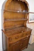 Reproduction oak dresser with arched top