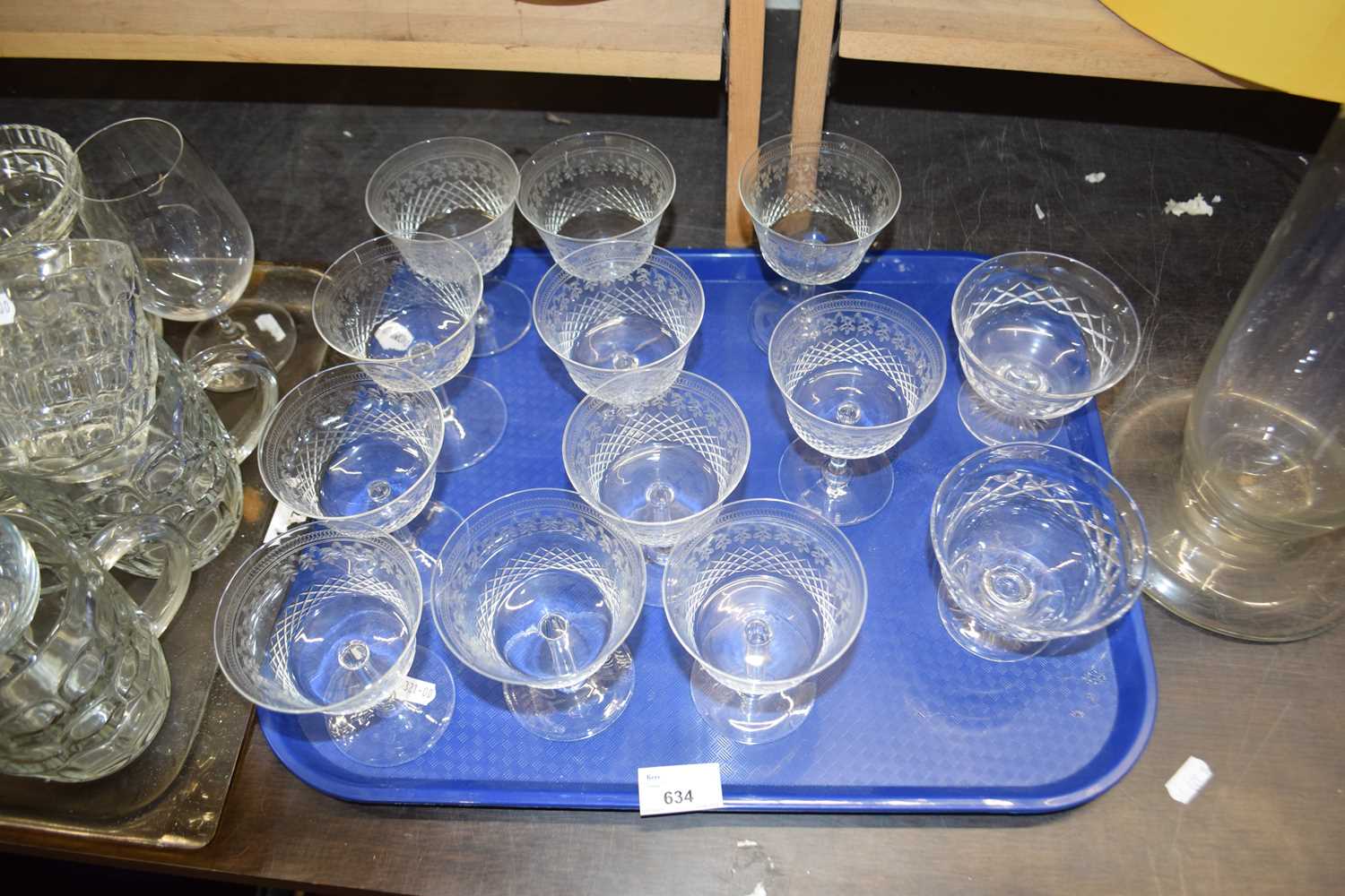 Quantity of assorted drinking glasses to include eleven engraved wine/champagne glasses and two