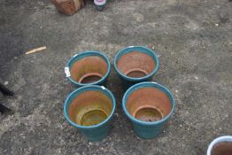 Set of four turquoise glazed plant pots