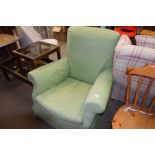 Armchair with green loose cover