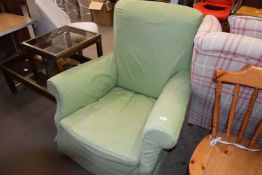Armchair with green loose cover
