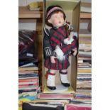 Collectors doll on stand of a Highland Piper in traditional Scottish dress, boxed