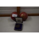 1924 cricket medal together with two vintage cricket balls