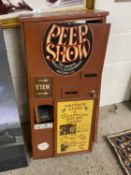 Modern novelty wall cabinet marked Peep Show