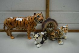 Two pottery models of tigers, another of a cat and a painted agate slice