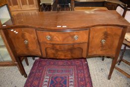 Reproduction mahogany serpentine front three drawer sideboard, 142cm wide