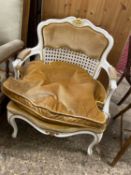Continental style armchair with white and gilt painted frame