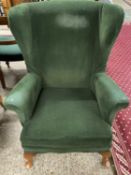 Early 20th Century green upholstered wing back armchair