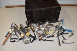 Wood and leather faux treasure chest containing a quantity of watches