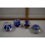 Four various assorted paperweights