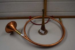 A copper hunting horn and a small hunting horn (2)