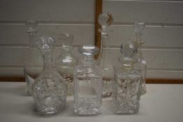 Collection of various clear glass decanters