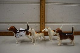 Four various Beswick fox hounds