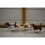 Four various Beswick fox hounds