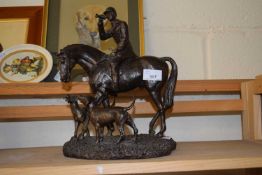 Bronzed resin of a huntsman and hounds, 32cm high