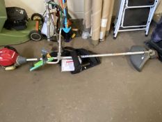 Honda strimmer with harness, spare blade & booklet.