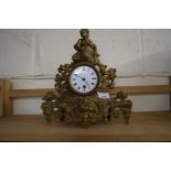Gilt metal mantel clock with round dial, Roman numerals, overall 30cm high