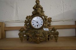 Gilt metal mantel clock with round dial, Roman numerals, overall 30cm high