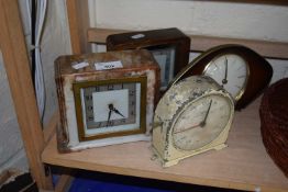 Three mantel clocks together with a timer