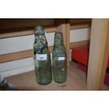 Two vintage glass bottles with beads to neck