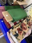 Five various rolls of fabric and baize