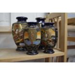 Two pairs of Japanese blue ground ceramic vases