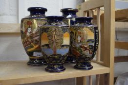 Two pairs of Japanese blue ground ceramic vases