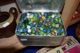Sandwich tin full of assorted glass marbles