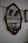 Oval bevelled wall mirror
