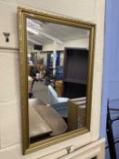 Modern wall mirror in gilt effect frame
