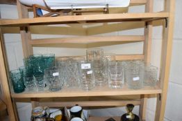 Quantity of assorted drinking glasses to include tumblers, pint mugs, half pint mugs, green glass
