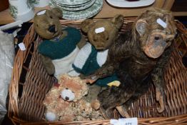 Basket containing a quantity of small teddies and a monkey