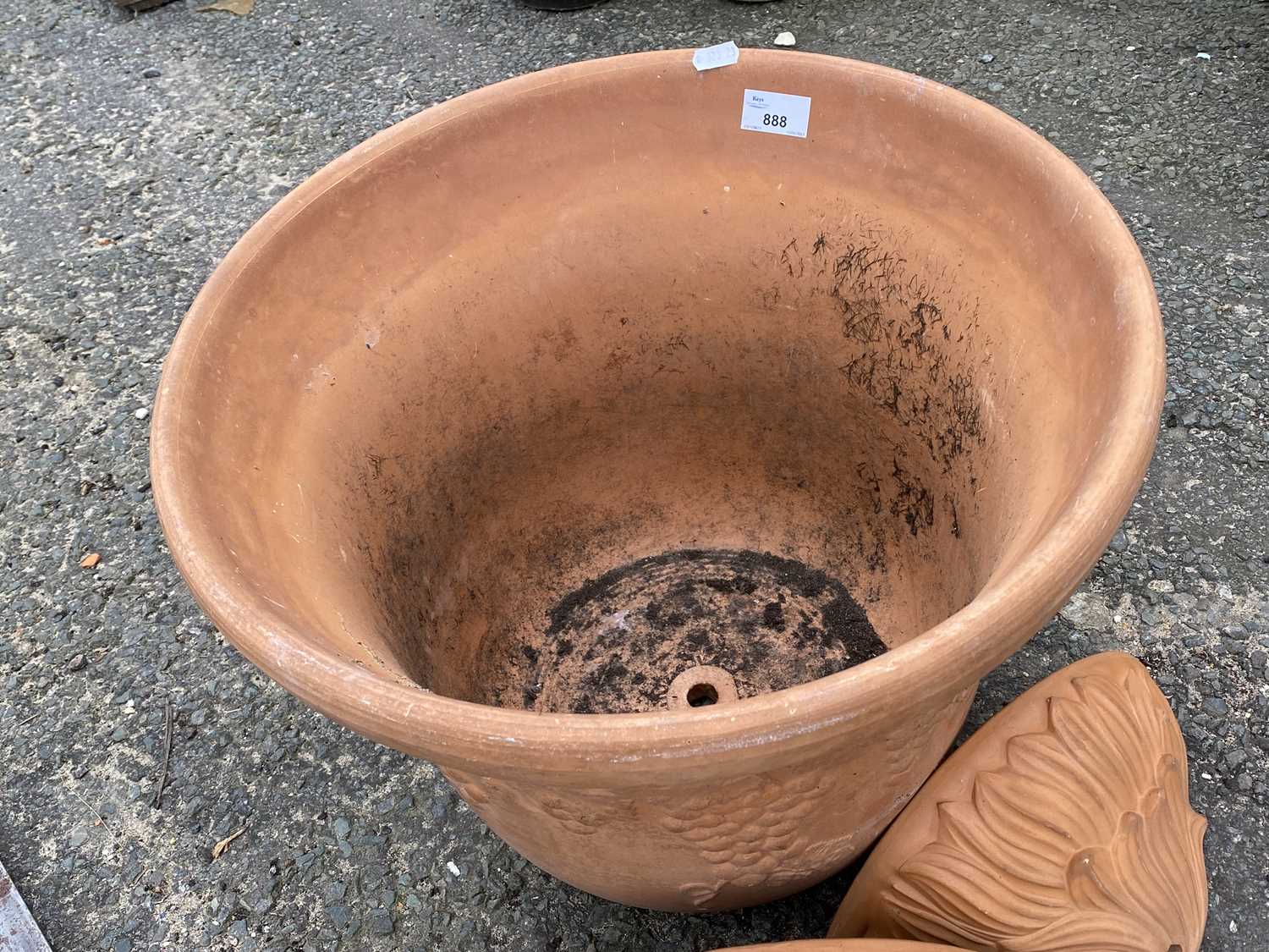 Pair of terracotta wall pockets and a large terracotta plant pot (3)