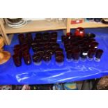 Large suite of mid 20th Century red glass ware to include wine glasses, tumblers and others