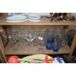 Quantity of assorted drinking glasses to include champagne flutes, cocktail glasses, wine glasses,