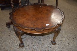 Reproduction walnut veneered coffee table on ball and claw feet