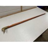 Walking stick with a brass duck's head handle