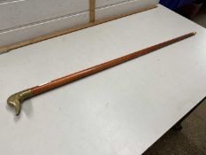 Walking stick with a brass duck's head handle