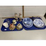 Two trays of mixed wares to include continental figures, rose formed porcelain handle holders,