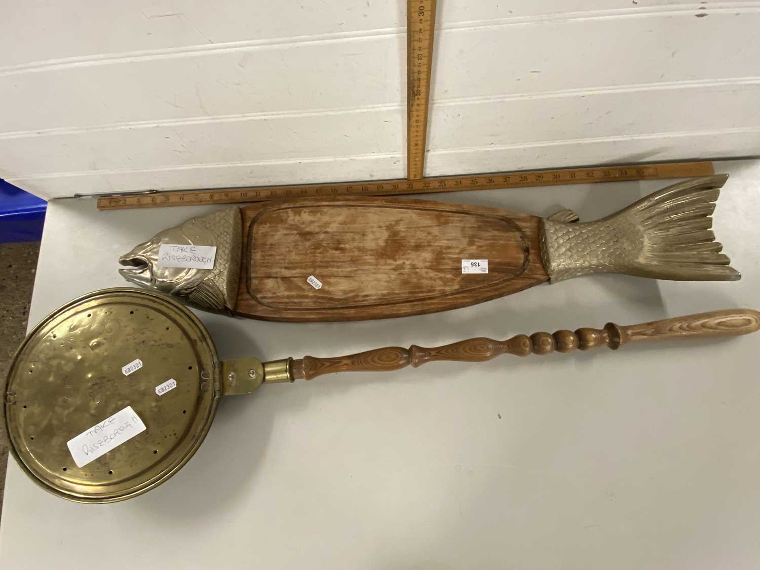 Large fish shaped serving board together with a brass bed warming pan