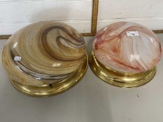 A pair of retro ceiling light fittings with marbled glass shades