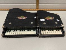 Two child's miniature pianos