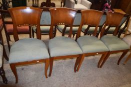Set of four modern dining chairs with panelled backs